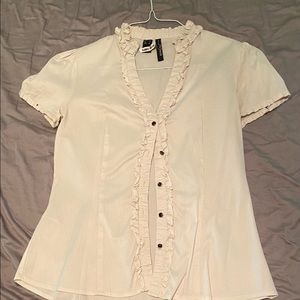 Cream button down top with ruffle detail